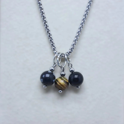 Collier 3 perles : Obsidienne mouchetée, Œil de Tigre et Obsidienne Œil Céleste - ENAE Minéraux